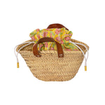 small straw basket with leather handles with a drawstring pouch lining